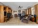 Welcoming living room featuring a fireplace, comfortable seating, and bright natural light at 18118 W Golden Ln, Waddell, AZ 85355