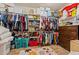 Organized walk-in closet with shelving, hanging racks, and storage, maximizing space and functionality at 18118 W Golden Ln, Waddell, AZ 85355