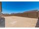 Large backyard with block wall fencing ready for custom landscaping and outdoor living at 18192 W Ashley Dr, Goodyear, AZ 85338