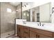 Bathroom with double vanity, undermount sinks, and glass shower at 18192 W Ashley Dr, Goodyear, AZ 85338