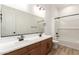 Bathroom with double sink vanity, modern fixtures, and shower over tub at 18192 W Ashley Dr, Goodyear, AZ 85338