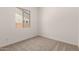 Bedroom featuring carpet floors, neutral walls, and a window at 18192 W Ashley Dr, Goodyear, AZ 85338