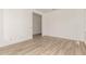 Bright bedroom featuring wood-look tile flooring and neutral paint palette at 18192 W Ashley Dr, Goodyear, AZ 85338