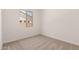 Bright bedroom with neutral carpeting and a window providing natural light at 18192 W Ashley Dr, Goodyear, AZ 85338