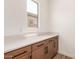Butler's pantry featuring sleek countertops, stylish cabinetry, and ample storage space for all your entertaining needs at 18192 W Ashley Dr, Goodyear, AZ 85338