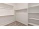 Walk-in closet with built-in shelving and ample storage space at 18192 W Ashley Dr, Goodyear, AZ 85338