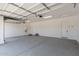 Spacious garage with concrete floors and an automatic garage door at 18192 W Ashley Dr, Goodyear, AZ 85338