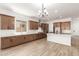 Spacious kitchen with a large island, stainless steel appliances, and stylish lighting, perfect for modern living at 18192 W Ashley Dr, Goodyear, AZ 85338