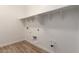 Bright laundry room with tile floors and washer and dryer hookups at 18192 W Ashley Dr, Goodyear, AZ 85338