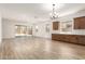 Expansive living area with tile floors, recessed lighting, and sliding glass doors to the backyard, perfect for entertaining at 18192 W Ashley Dr, Goodyear, AZ 85338