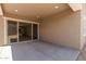 Covered patio featuring recessed lighting and sliding glass doors leading into the home at 18192 W Ashley Dr, Goodyear, AZ 85338