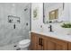 Modern bathroom with a stylish vanity, sleek fixtures, and a glass-enclosed shower showcasing elegant tile work at 2041 W Palo Verde Dr, Phoenix, AZ 85015