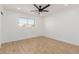 Bedroom features hardwood floors, a ceiling fan, and window for natural light at 2041 W Palo Verde Dr, Phoenix, AZ 85015