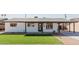 Charming home featuring a manicured lawn, modern black trim, and a covered carport at 2041 W Palo Verde Dr, Phoenix, AZ 85015