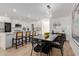 Modern eat-in kitchen features stainless steel appliances, quartz counters, and island seating at 2041 W Palo Verde Dr, Phoenix, AZ 85015