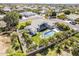 Aerial view of a home with a pool, mature trees and greenery, and a fully fenced private backyard at 2251 N 32Nd St # 21, Mesa, AZ 85213