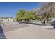 Manicured backyard landscape showcasing trees, walkways, and accessibility features at 2251 N 32Nd St # 21, Mesa, AZ 85213