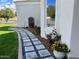 Landscaped backyard with stone paver walkway, fountain, and lush plantings, enhancing outdoor beauty at 2251 N 32Nd St # 21, Mesa, AZ 85213