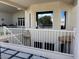 Balcony view showing multiple windows with a view, white railing, and outdoor seating area at 2251 N 32Nd St # 21, Mesa, AZ 85213