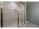 Bathroom featuring a shower and bathtub combination with glass doors, toilet, and tiled walls at 2251 N 32Nd St # 21, Mesa, AZ 85213