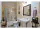 Traditional bathroom featuring a shower, a large mirror, and a pedestal sink with white walls at 2251 N 32Nd St # 21, Mesa, AZ 85213