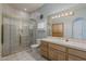 Tiled bathroom featuring a walk-in shower, vanity, and toilet at 2251 N 32Nd St # 21, Mesa, AZ 85213