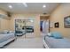 Bright bedroom featuring a mirrored closet, beds, recessed lights, and a neutral colored walls at 2251 N 32Nd St # 21, Mesa, AZ 85213