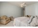 Tranquil bedroom features a plush bed, cozy chairs, and light blue walls at 2251 N 32Nd St # 21, Mesa, AZ 85213