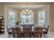 Dining room featuring a wooden table, metal chairs, and bay window with outdoor views at 2251 N 32Nd St # 21, Mesa, AZ 85213