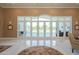 Bright foyer boasts high ceilings, marble floors, and an expansive wall of windows to backyard at 2251 N 32Nd St # 21, Mesa, AZ 85213