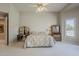 Bright main bedroom featuring neutral walls, carpet flooring, and classic furniture at 2251 N 32Nd St # 21, Mesa, AZ 85213