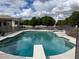 Backyard pool with a diving board and safety fence provides a secure area to relax at 2251 N 32Nd St # 21, Mesa, AZ 85213