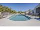 Inviting pool area surrounded by lush greenery and a secure fence for added safety at 2251 N 32Nd St # 21, Mesa, AZ 85213