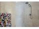 Close up of shower with beige tile, rainfall shower head, and towel rack at 2251 N 32Nd St # 21, Mesa, AZ 85213