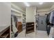 Spacious walk-in closet with built-in shelving, hanging rods, and full-length mirror at 2251 N 32Nd St # 21, Mesa, AZ 85213