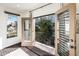 Balcony access with iron railing, bright light and large tree view at 231 W Portland St, Phoenix, AZ 85003