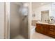 Bathroom featuring double sinks, a tub, and a glass-enclosed shower at 231 W Portland St, Phoenix, AZ 85003