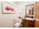 Powder room features a pedestal sink and tiled floors at 231 W Portland St, Phoenix, AZ 85003