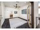 Bedroom with ceiling fan and balcony access leading to bathroom at 231 W Portland St, Phoenix, AZ 85003