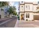 Beautiful condo showcasing a cozy entryway with vibrant green wreath on the stained wood door at 231 W Portland St, Phoenix, AZ 85003