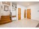 Spacious hallway featuring beautiful wood stairs, built-in storage, and lovely natural light at 231 W Portland St, Phoenix, AZ 85003