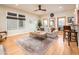 Bright living room featuring hardwood floors, large windows and a ceiling fan at 231 W Portland St, Phoenix, AZ 85003