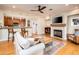 Open-concept living room and kitchen area with a fireplace and hardwood floors at 231 W Portland St, Phoenix, AZ 85003