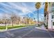 Scenic street view featuring palm trees and modern buildings. Sunny clear blue skies at 231 W Portland St, Phoenix, AZ 85003