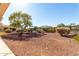 Expansive backyard with desert landscaping and a charming fence, perfect for outdoor enjoyment at 23116 N Padaro Ct, Sun City West, AZ 85375