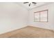 Bedroom features carpet and window to provide natural light at 23116 N Padaro Ct, Sun City West, AZ 85375