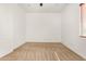 An empty bedroom with neutral carpet and a large window providing ample natural light at 23116 N Padaro Ct, Sun City West, AZ 85375