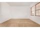 Bright carpeted bedroom with windows and natural light at 23116 N Padaro Ct, Sun City West, AZ 85375