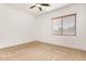 A bright and airy bedroom with a ceiling fan and natural light through window with blinds at 23116 N Padaro Ct, Sun City West, AZ 85375