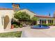 Beautiful clubhouse entry with lush landscaping, decorative fountain, and inviting architecture at 23116 N Padaro Ct, Sun City West, AZ 85375